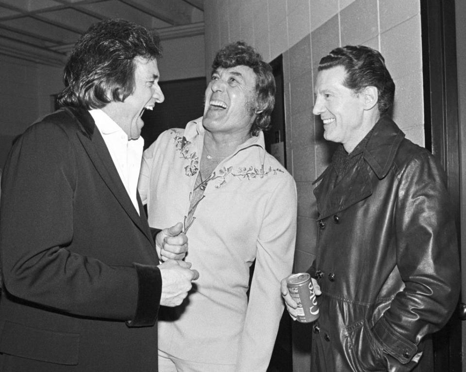 <p>Some of the country's greatest musicians, Johnny Cash, Carl Perkins, and Jerry Lee Lewis, gather together backstage after their concert in Madison, Wisconsin in 1982. </p>