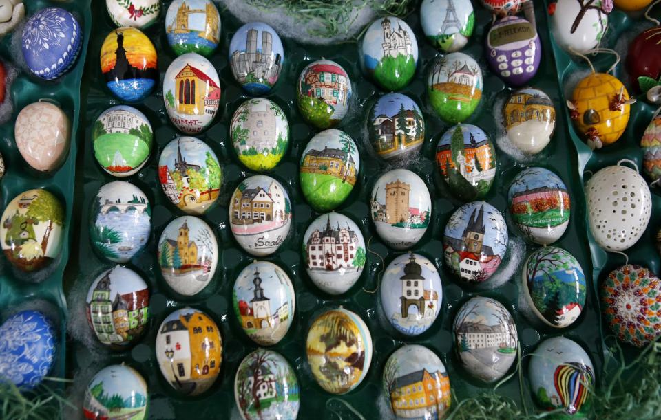 Colourful hand-painted Easter eggs are displayed before German pensioners Christa and Volker Kraft decorate an apple tree with them in Saalfeld