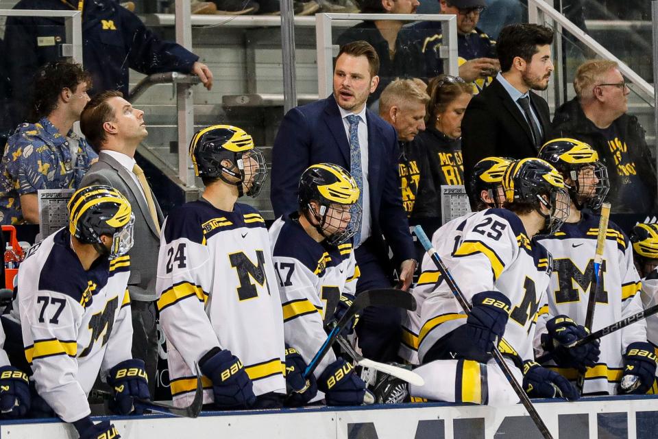 Michigan head coach Brandon Naurato talks to players during the first period against Michigan State at Yost Ice Arena in Ann Arbor on Friday, Feb. 9, 2024.