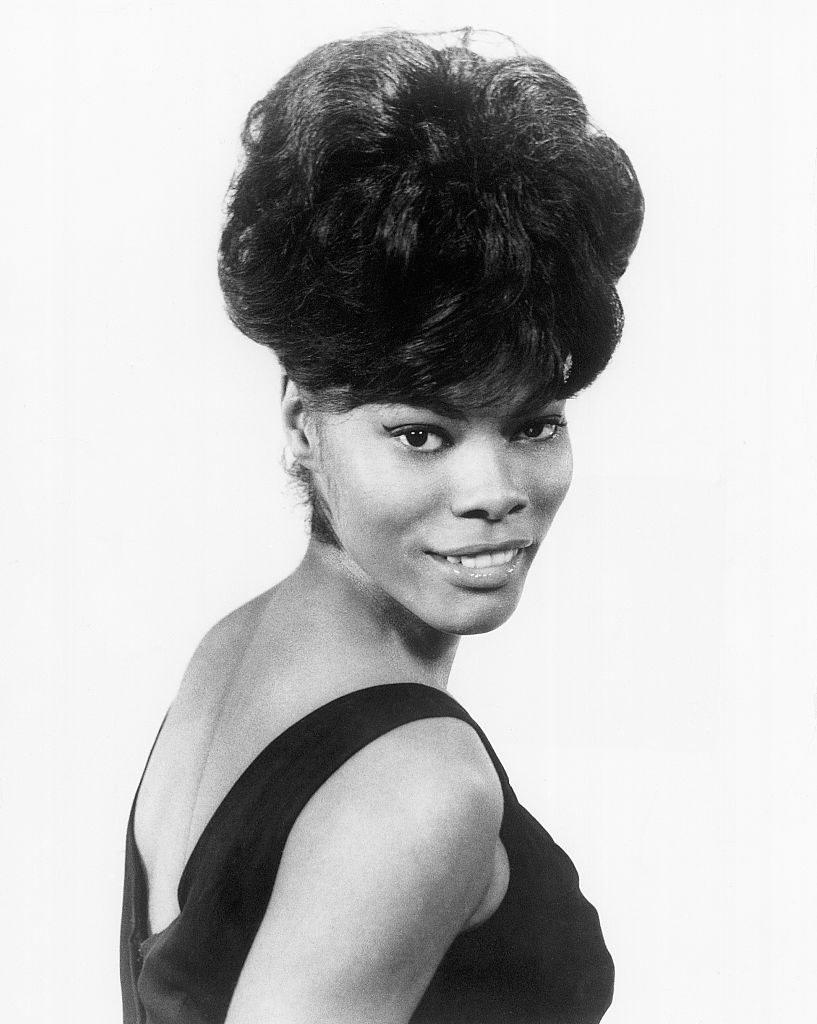 Dionne Warwick wearing a black cocktail dress