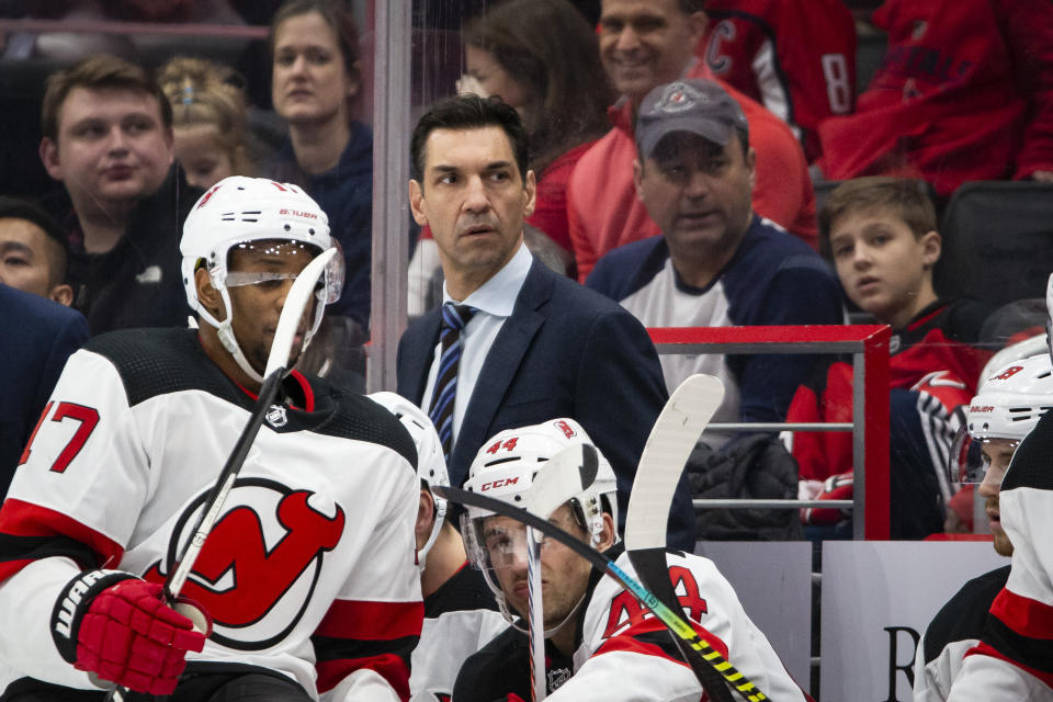 New Jersey Devils interim coach Alain Nasreddine watches during the second period of an NHL hockey game against the Washington Capitals, Thursday, Jan. 16, 2020, in Washington. (AP Photo/Al Drago)