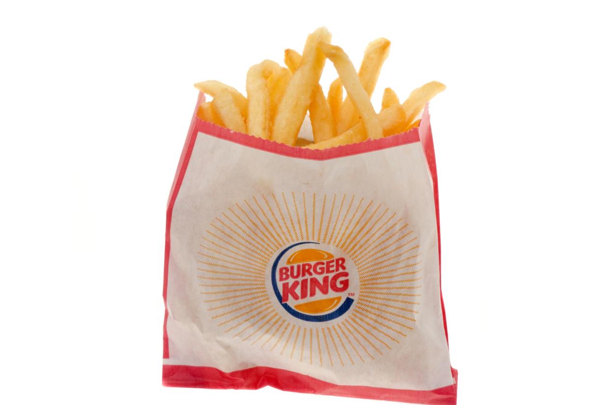 London, United Kingdom- July 26, 2011: Large size paper bag Burger King fries shot in the studio with a white background.