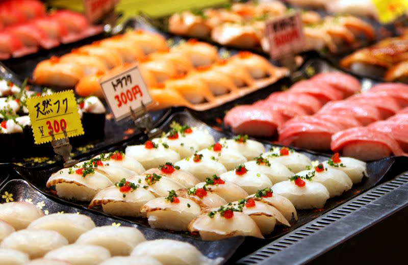 Blowfish sushi line is seen on a display window at a market in Shimonosek