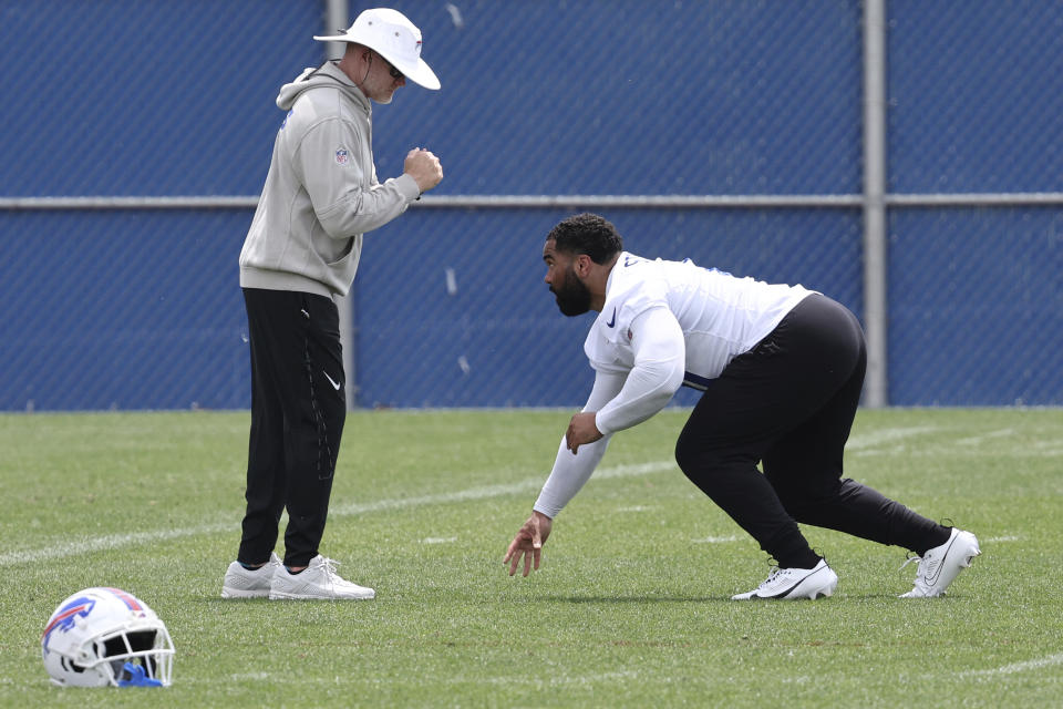 Buffalo Bills head coach Sean McDermott works with defensive tackle Gable Steveson (61) following NFL football practice in Orchard Park, N.Y., Tuesday, June 4, 2024. (AP Photo/Jeffrey T. Barnes)