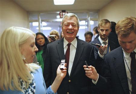 U.S. Senator Max Baucus (D-MT) talks to reporters after the Senate passed a spending bill to avoid a government shutdown at the U.S. Capitol in Washington in this file photo September 27, 2013. REUTERS/Jonathan Ernst/Files