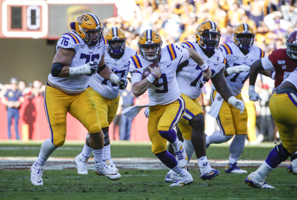 LSU Tigers quarterback Joe Burrow (9) carries the ball against the Alabama Crimson Tide during the first half at Bryant-Denny Stadium. (USA Today)