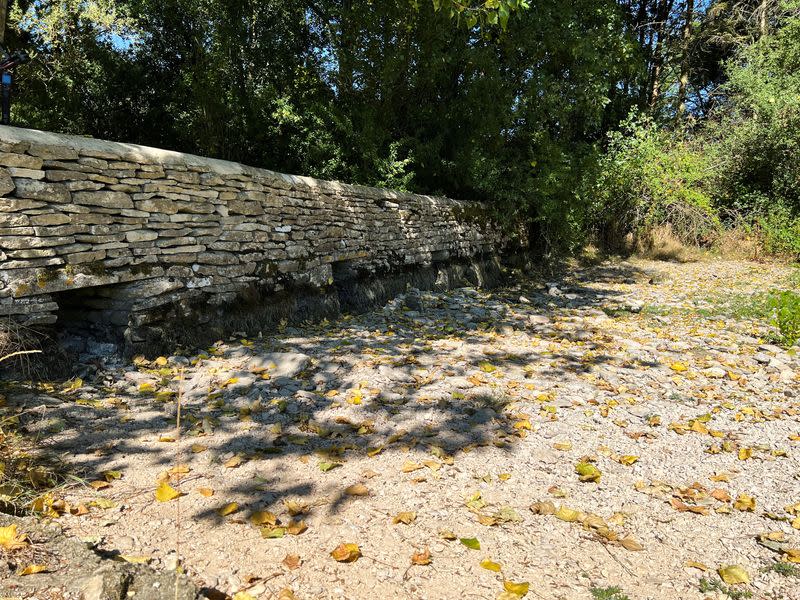 A general view of a weir and dried riverbed near the source of the River Thames, in Kemble