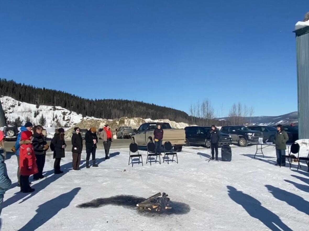 The Trʼondëk Hwëchʼin First Nation held a sacred fire in Dawson City, Yukon, on Wednesday to honour the lives lost in Mayo, and the residents who continue to grieve yet another loss in their community.  (Chris MacIntyre/CBC - image credit)