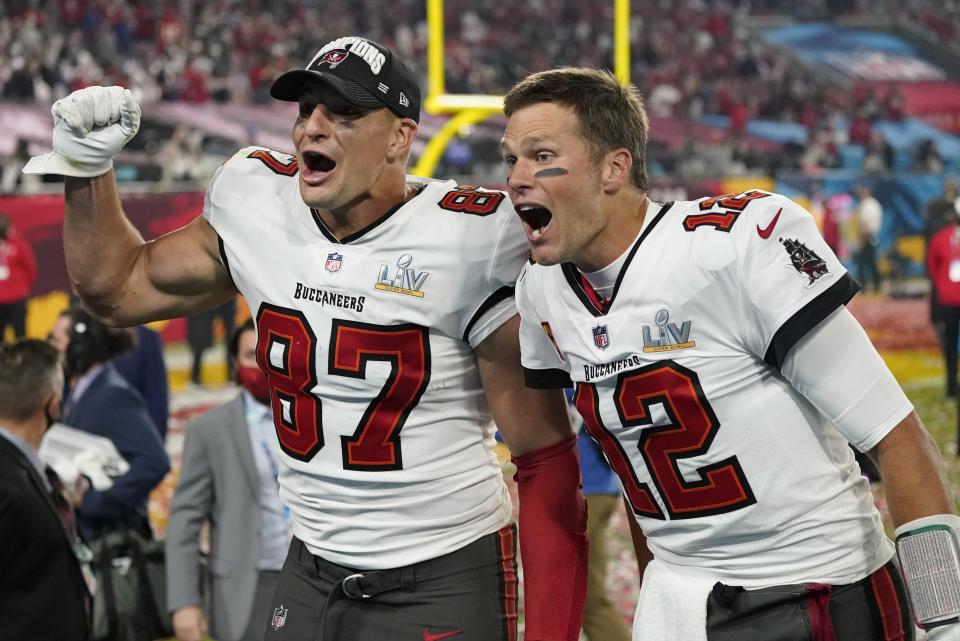 Tampa Bay Buccaneers tight end Rob Gronkowski, left, and quarterback Tom Brady celebrate after defeating the Kansas City Chiefs in the NFL Super Bowl 55 football game Sunday, Feb. 7, 2021, in Tampa, Fla. The Buccaneers defeated the Chiefs 31-9 to win the Super Bowl. (AP Photo/Ashley Landis)