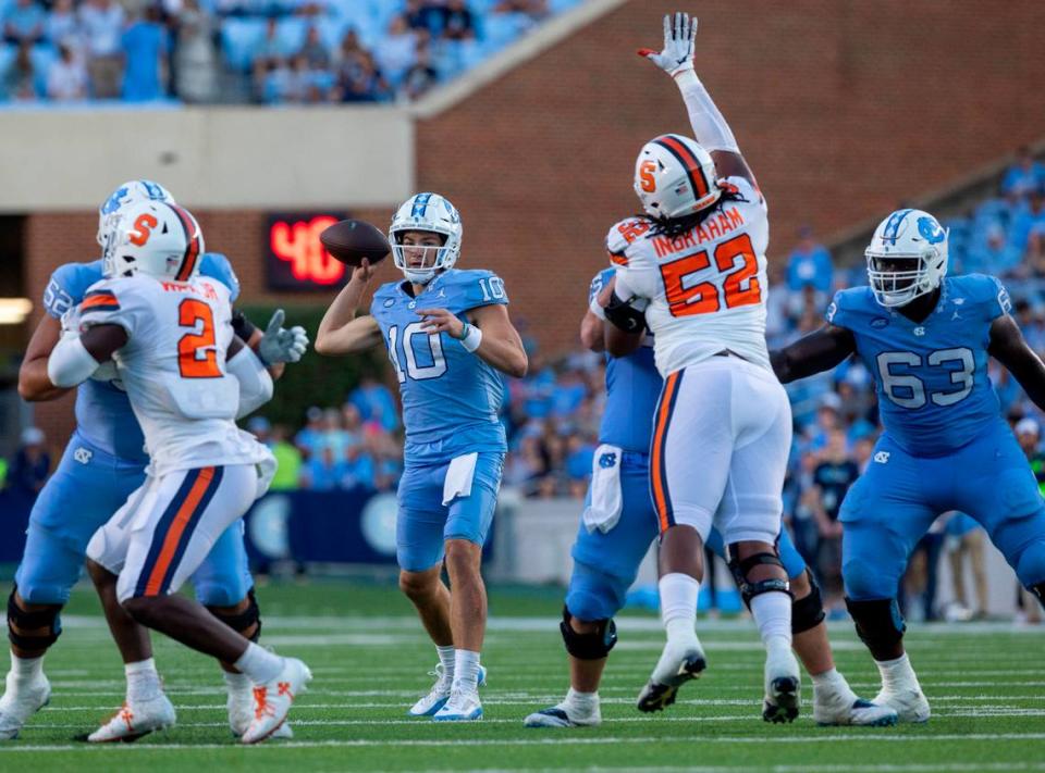 North Carolina quarterback Drake Maye (10) looks for a receiver in the fourth quarter against Syracuse on Saturday, October 7, 2023 at Kenan Stadium in Chapel Hill, N.C. Maye passed for 442 yards and three touchdowns in the Tar Heels’ 40-7 victory.