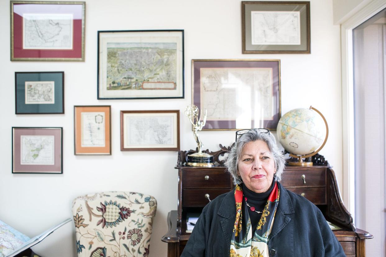 Liz Colton sits in the study of her South Asheville home in this Jan. 20, 2015 photo. The former foreign correspondent was once a producer for the legendary broadcast journalist Barbara Walters.