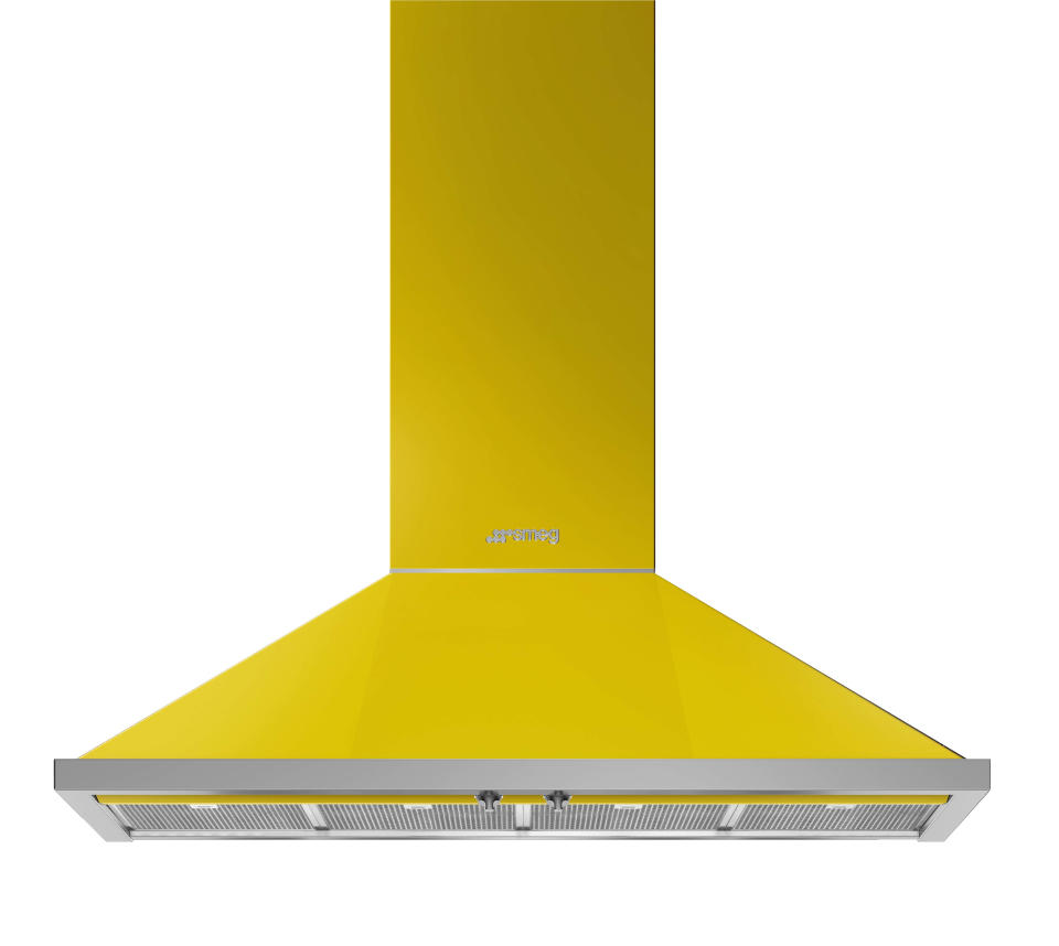 This photo provided by SMEG USA shows one of their range hoods. If you're keen to take a bigger leap into yellow beyond just paint or accessories, consider appliances. SMEG has a suite of stoves, range hoods and fridges in the hue; paired with neutral colors, stone and wood, the look is upbeat and uber cool. (SMEG USA via AP)