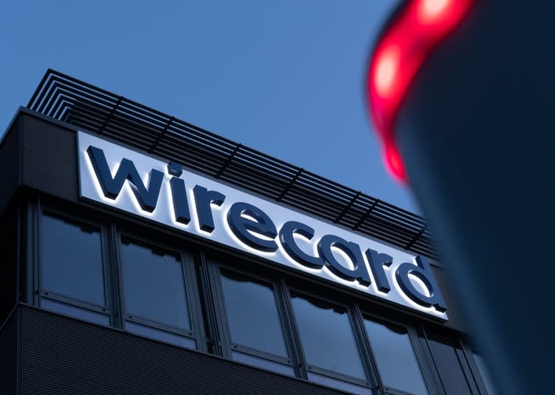 The Wirecard logo can be seen at the former headquarters of the former payment service provider. Peter Kneffel/dpa