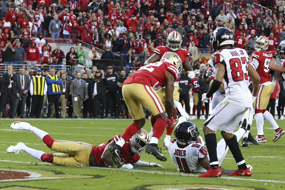 Atlanta Falcons wide receiver Julio Jones (11) sits next to the goal line after scoring against the San Francisco 49ers during the second half of an NFL football game in Santa Clara, Calif., Sunday, Dec. 15, 2019. (AP Photo/John Hefti)