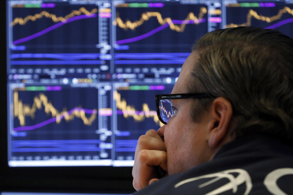 Specialist Gregg Maloney watches the screens at his post on the floor of the New York Stock Exchange, Tuesday, Jan. 28, 2020. Stocks are moving broadly higher on Wall Street in afternoon trading Tuesday, reversing most of the indexes' losses from a sell-off the day before. (AP Photo/Richard Drew)