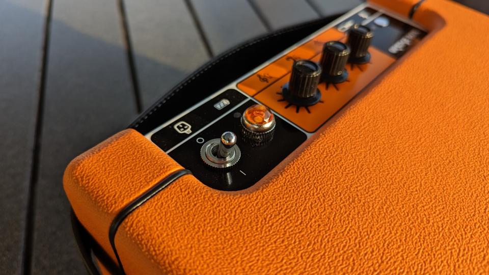 Close up of controls on the Orange Box Bluetooth speaker