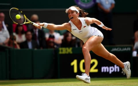 Johanna Konta stretches to play a forehand in her Ladies' Singles fourth round match against Petra Kvitova - Credit: GETTY IMAGES