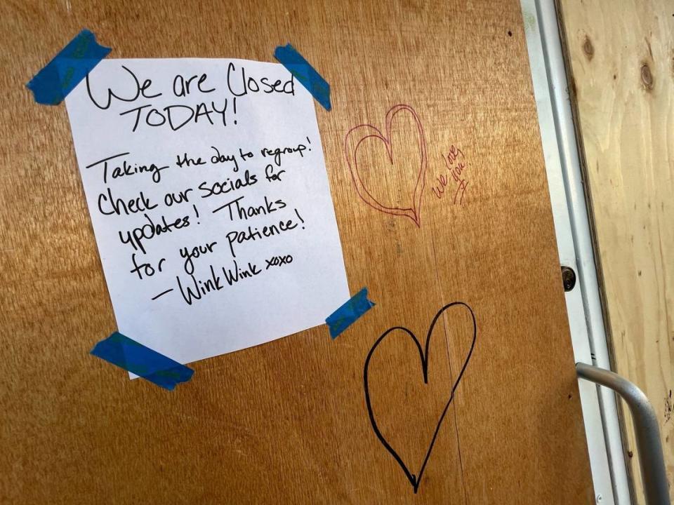 Well-wishers left notes for Jenn Mason and WInk Wink employees on the boarded-up door of her business at 1302 Commercial St. in Bellingham, Wash., on Monday, Aug. 8, 2022.