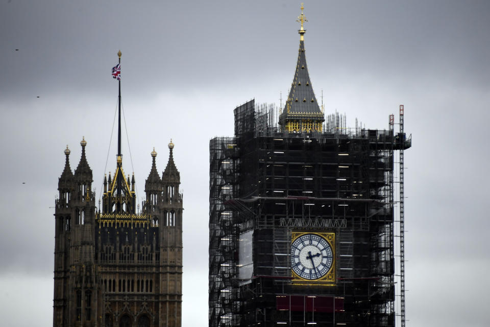 A view of the Victoria Tower, left, and the Elizabeth Tower, which holds the bell known as "Big Ben", in London, Friday, Nov. 1, 2019. British euroskeptic politician Nigel Farage is trying to ramp up the pressure on Conservative Prime Minister Boris Johnson. He warned that his Brexit Party will run against the Conservatives across the country in the Dec. 12 general election unless Johnson abandons his divorce deal with the European Union. (AP Photo/Alberto Pezzali)
