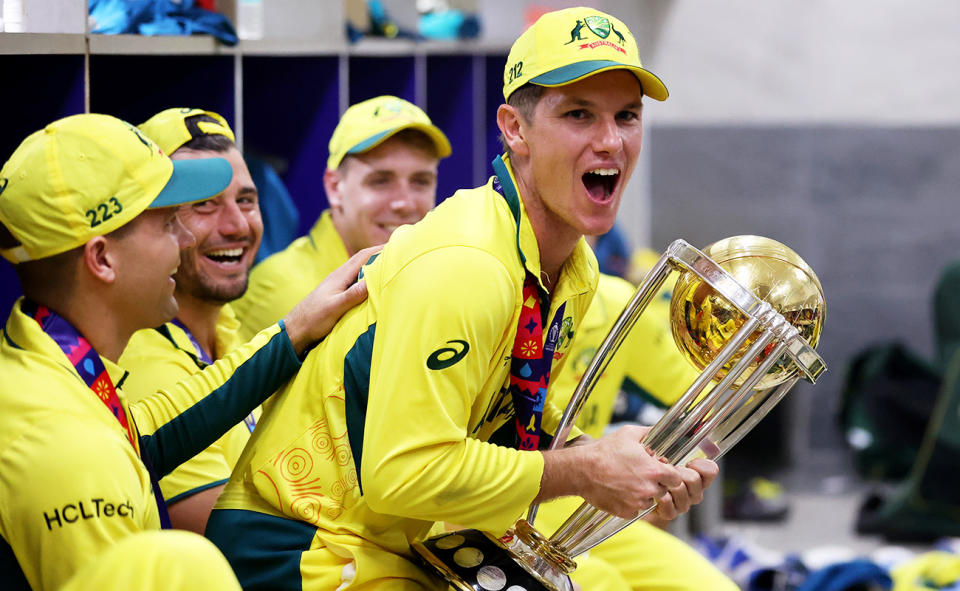 Adam Zampa, pictured here with the Cricket World Cup trophy. 