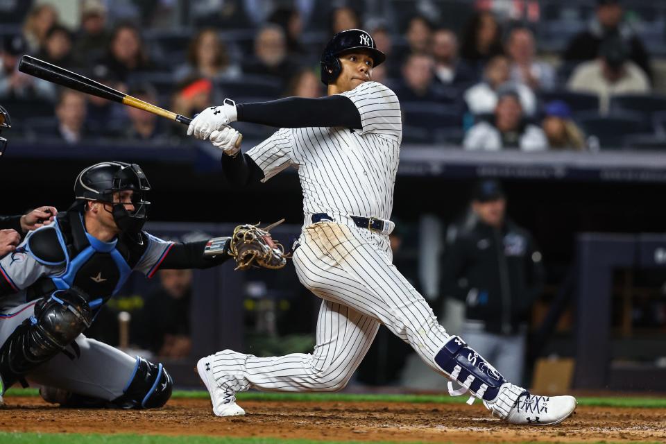 Apr 10, 2024; Bronx, New York, USA; New York Yankees right fielder Juan Soto (22) hits an RBI double in the eighth inning against the Miami Marlins at Yankee Stadium. Mandatory Credit: Wendell Cruz-USA TODAY Sports