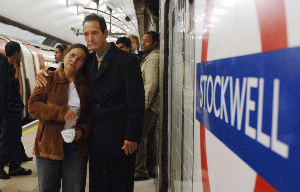 London, UNITED KINGDOM:  Matozinhos Otone Da Silva and Maria Otone de Menezes, the parents of Brazilian electrician Jean Charles de Menezes, who was shot dead by armed police visit the scene of the shooting in Stockwell Tube station in south London, 28 September 2005. The 27-year-old was mistaken for a suicide bomber by police on July 22 and shot seven times in the head. AFP PHOTO/ John Stillwell/ Pool  (Photo credit should read JOHN STILLWELL/AFP via Getty Images)