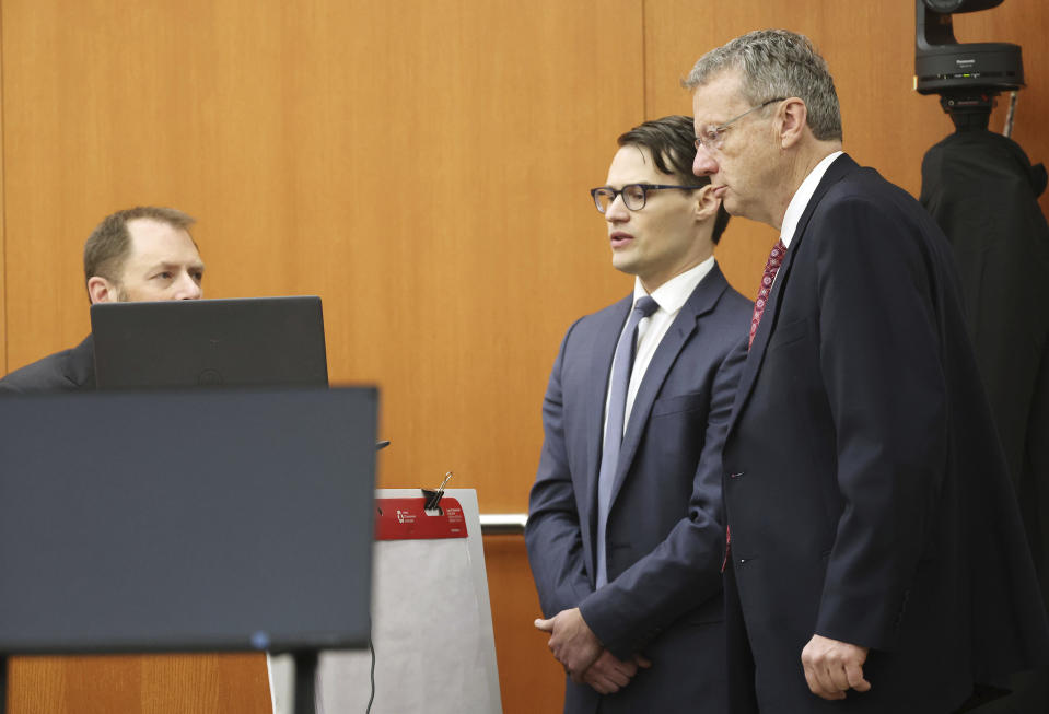Attorneys James Egan, center, and Lawrence Buhler watch a simulation from Dr. Irving Scher, left, during the lawsuit trial of Terry Sanderson vs. Gwyneth Paltrow, Tuesday, March 28, 2023, in Park City, Utah. Paltrow is accused in a lawsuit of crashing into a skier during a 2016 family ski vacation, leaving him with brain damage and four broken ribs. (Jeffrey D. Allred/The Deseret News via AP, Pool)