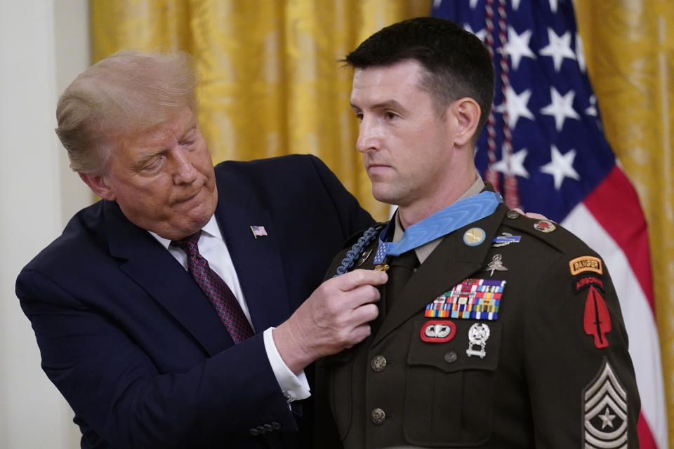 President Donald Trump awards the Medal of Honor to Army Sgt. Maj. Thomas P. Payne in the East Room of the White House on Friday, Sept. 11, 2020, in Washington. (AP Photo/Andrew Harnik)