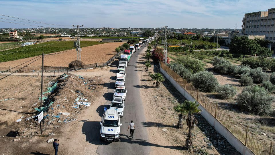 Humanitarian aid trucks arriving from Egypt after having crossed through the Rafah border crossing arrive at a storage facility in Khan Younis, in the southern Gaza Strip on October 21. - Belal Al Sabbagh/AFP/Getty Images