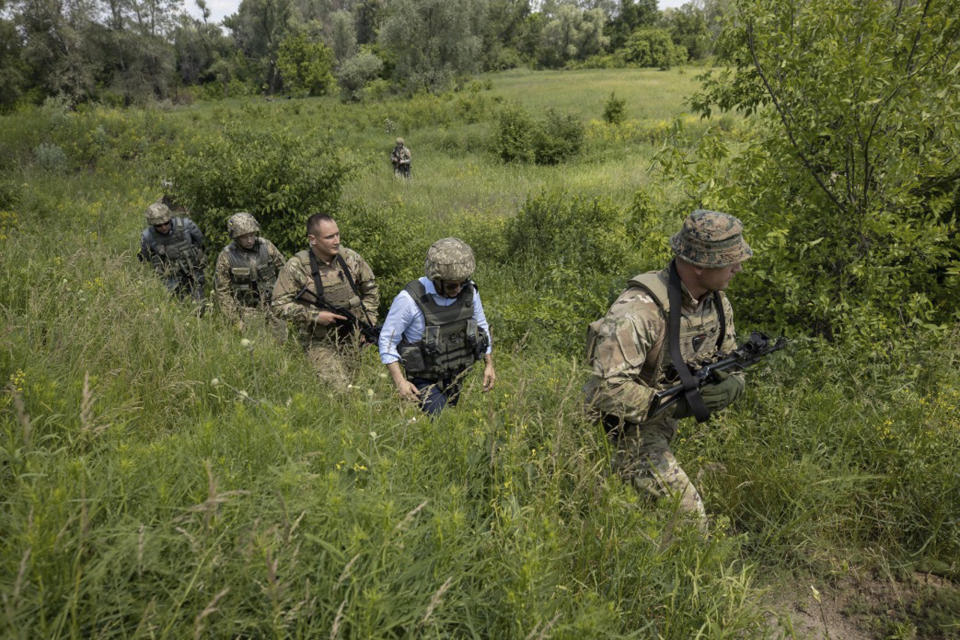 Ukrainian President Volodymyr Zelenskiy, second right, visits the war-hit Luhansk region, eastern Ukraine, Monday, May 27, 2019. (Ukrainian Presidential Press Office via AP)