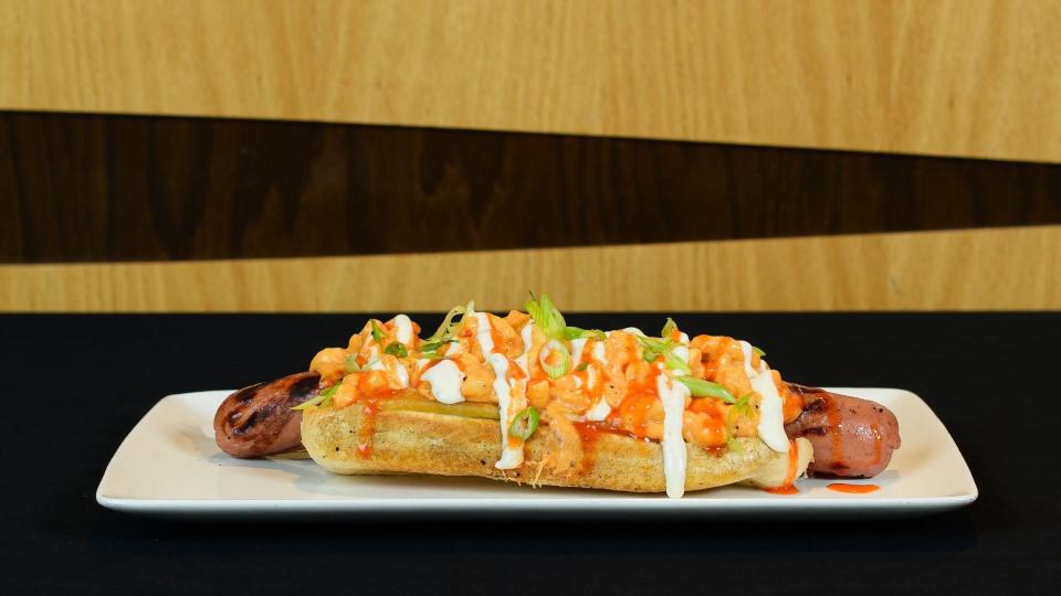 The new WONE HomeRocker features a half-pound, footlong hot dog covered in a buffalo chicken mac and cheese with a hot honey sauce and a ranch drizzle.
