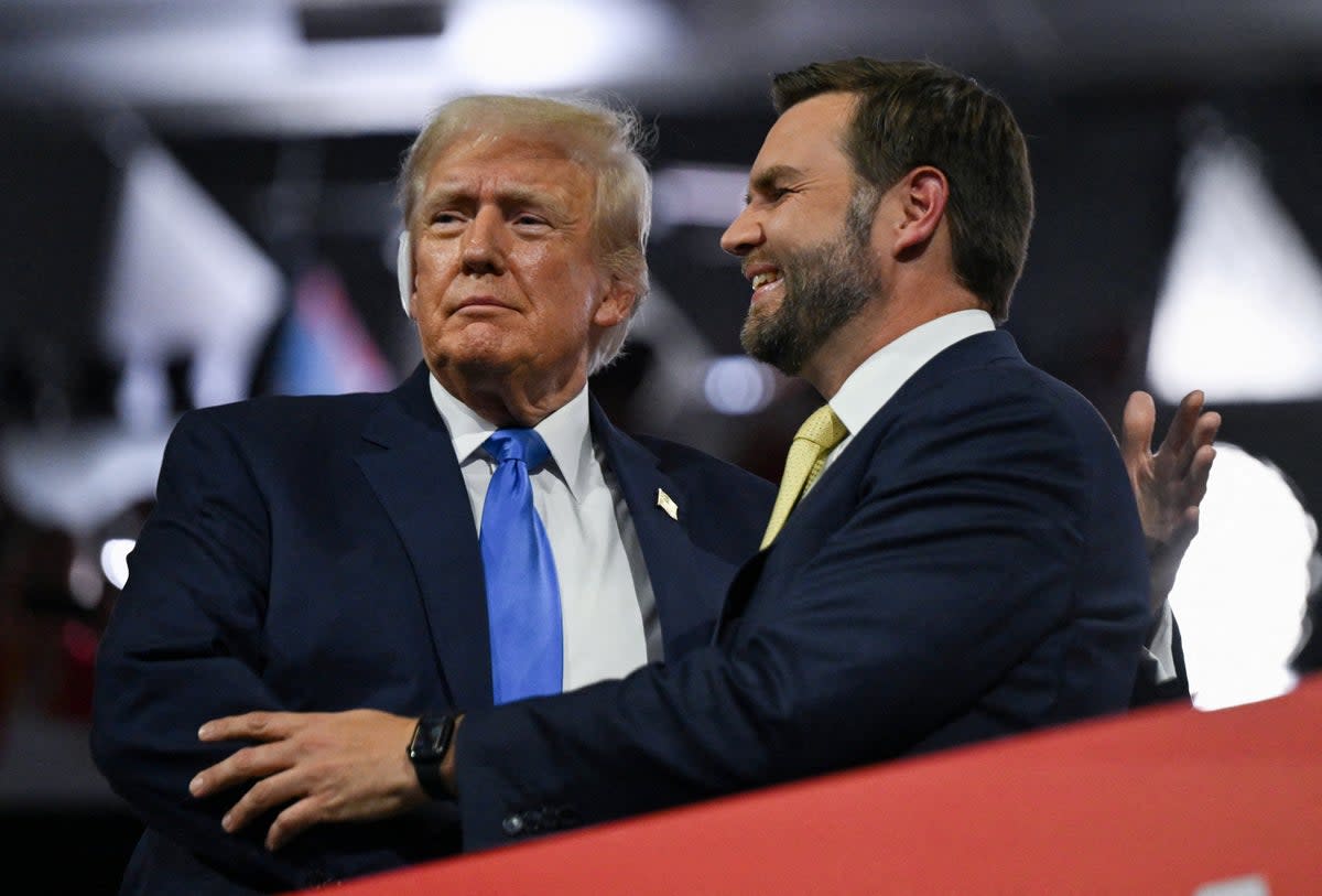 Republican presidential nominee and former U.S. President Donald Trump and Republican vice presidential nominee J.D. Vance embrace on Day 2 of the Republican National Convention (RNC), at the Fiserv Forum in Milwaukee, Wisconsin (REUTERS)