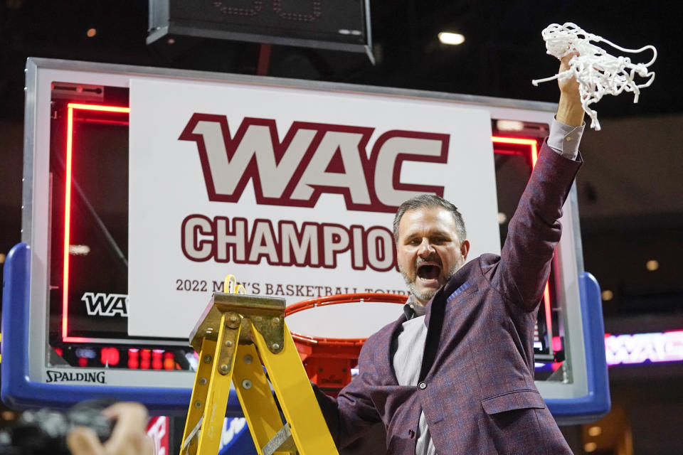 FILE - Then-New Mexico State coach Chris Jans holds up the net following the team's victory over Abilene Christian in an NCAA college basketball game for the championship of Western Athletic Conference men's tournament on March 12, 2022, in Las Vegas. Jans wants Mississippi State to experience March Madness just as he did coaching New Mexico State. Jans replaced Ben Howland and takes over a MSU program seeking to move up from the three NIT appearances it had recently become accustomed to the past five years, including last spring. (AP Photo/Rick Bowmer, File)