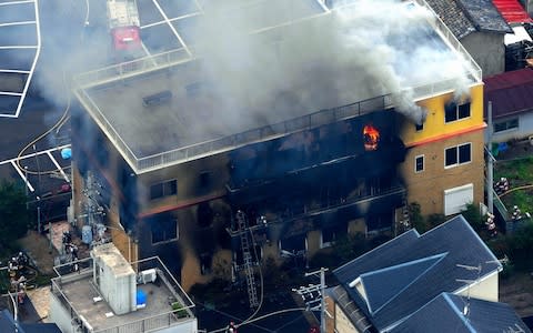 The suspect was heard to shout “Die” before using a lighter to start the fire - Credit: Asahi Shimbun