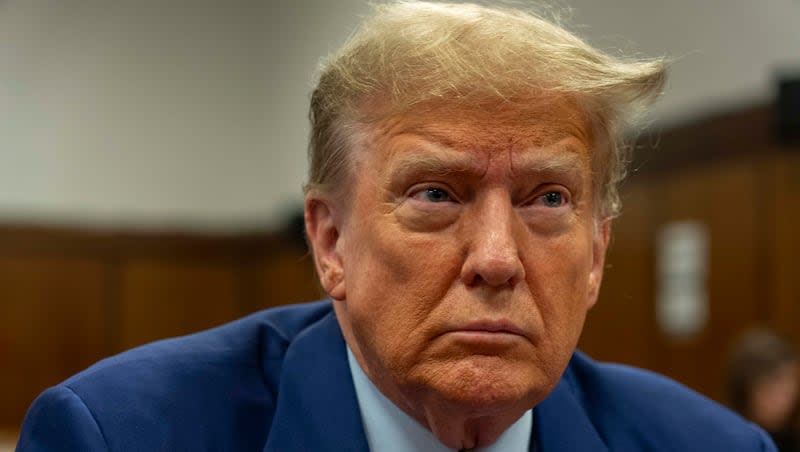 Former President Donald Trump awaits the start of proceedings on the second day of jury selection at Manhattan criminal court, Tuesday, April 16, 2024, in New York. Trump returned to the courtroom Tuesday as a judge works to find a panel of jurors who will decide whether the former president is guilty of criminal charges alleging he falsified business records to cover up a sex scandal during the 2016 campaign.