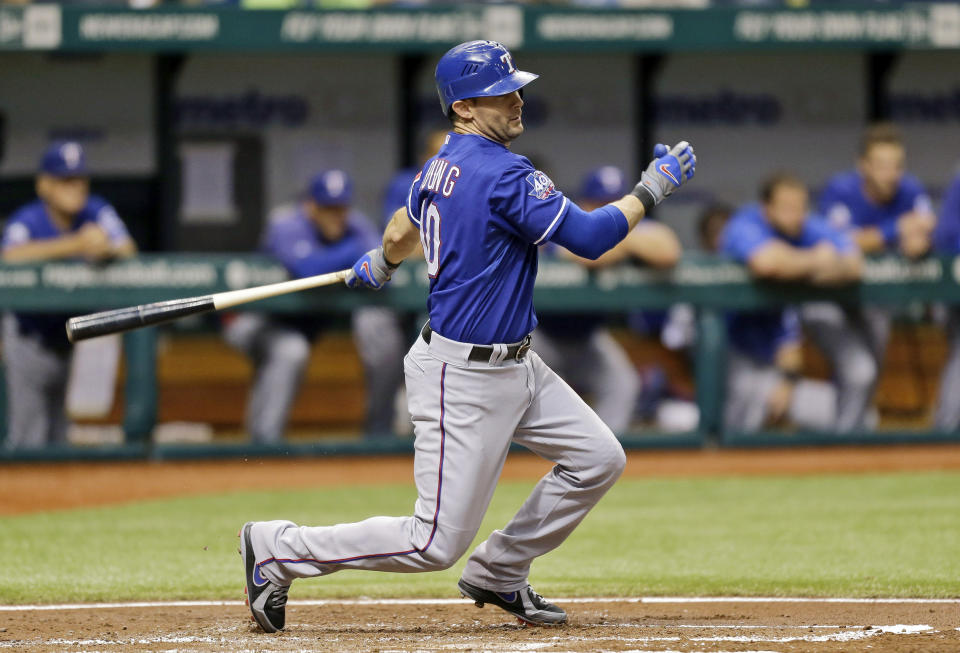 FILE - In this Sept. 7, 2012, file photo, Texas Rangers' Michael Young bats against the Tampa Bay Rays during a baseball game in St. Petersburg, Fla. Young is retiring after a 13-year major league career, nearly all of it with the Rangers. The seven-time All-Star retires with a .300 career average and as Texas' hits leader with 2,230. He was the 2008 AL Gold Glove at shortstop. (AP Photo/Chris O'Meara, File)