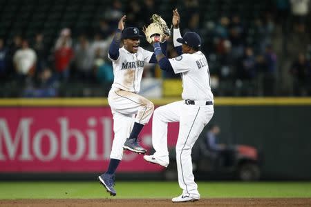 Apr 1, 2019; Seattle, WA, USA; Seattle Mariners center fielder Mallex Smith (left) celebrates with shortstop Tim Beckham (right) after defeating the Los Angeles Angels at T-Mobile Park. Mandatory Credit: Jennifer Buchanan-USA TODAY Sports