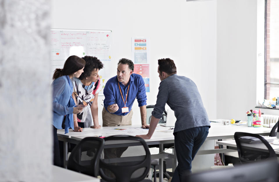 Business people having meeting in tech start-up office