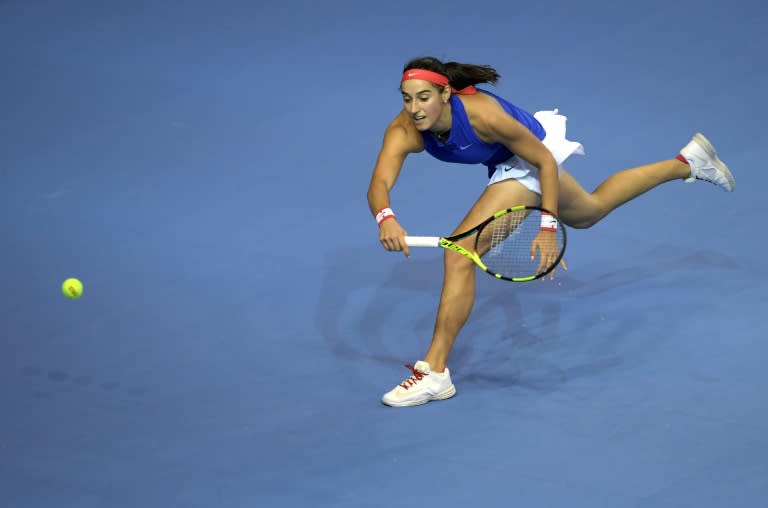 France's Caroline Garcia returns a ball to Czech Republic's Petra Kvitova, on November 12, 2016 in Strasbourg, eastern France, during their Fed Cup final tennis match between France and Czech Republic