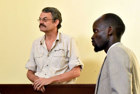 William John Endley, a South African national and an adviser to South Sudanese rebel leader Riek Machar, stands in the dock, as his Lawyer Gar Adel Gar looks on, in the High Court in Juba, South Sudan February 13, 2018. REUTERS/Samir Bol