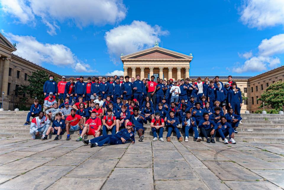 Milton High School football players and coaches pose for a photo in Philadelphia, Pennsylvania in fall 2021.