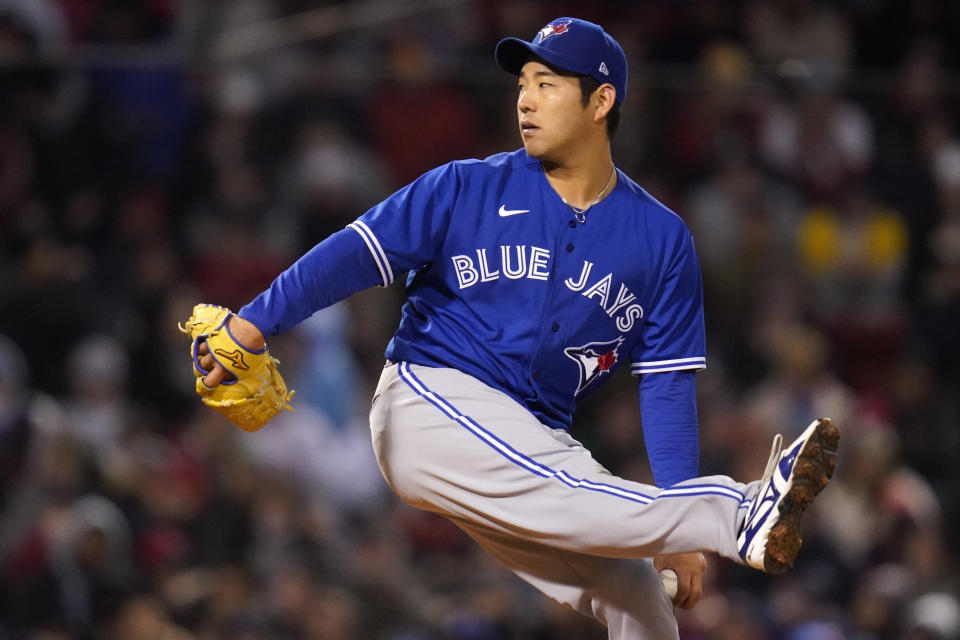 Toronto Blue Jays starting pitcher Yusei Kikuchi kicks while delivering a pitch during the first inning of a baseball game against the Boston Red Sox, Tuesday, April 19, 2022, at Fenway Park in Boston. (AP Photo/Charles Krupa)