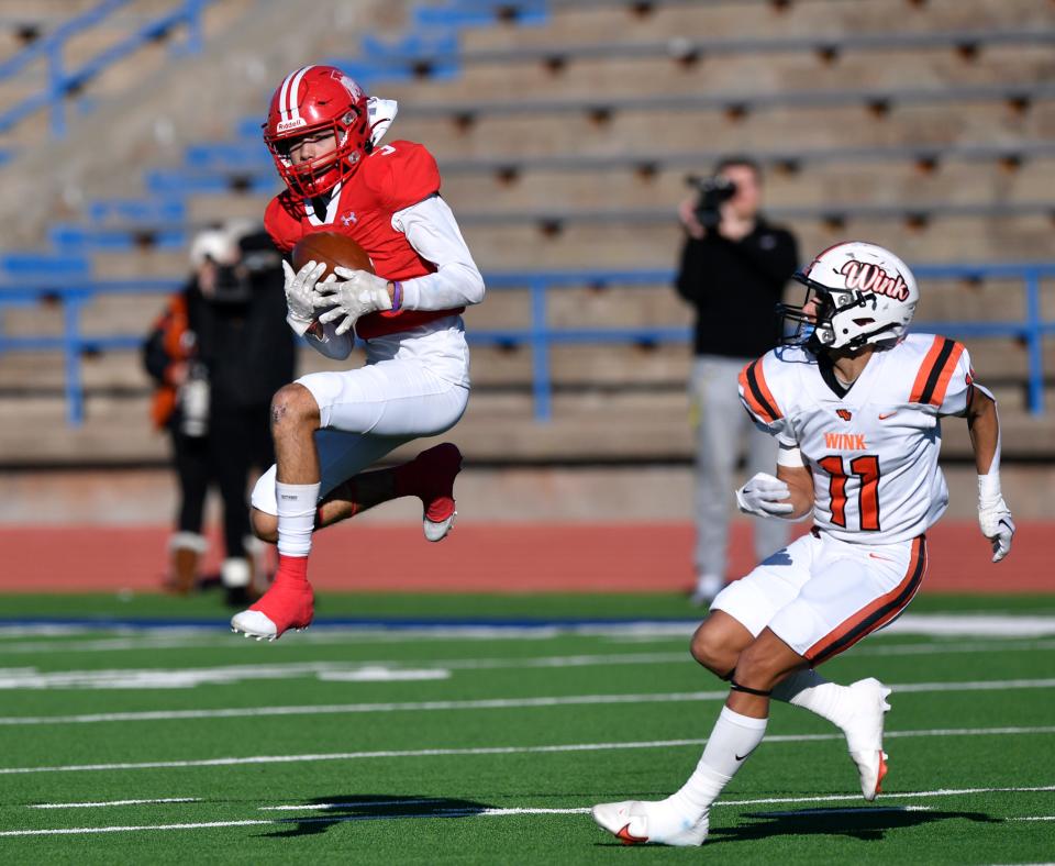 Albany safety London Fuentes intercepts a pass meant for Wink wide receiver Zach Yactayo during Saturday's Class 2A Division II regional semifinal in San Angelo.