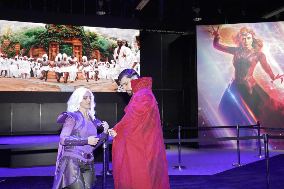 Cosplayers dressed as Clea and Doctor Strange stand at a Marvel Comics exhibit at the D23 Expo Saturday, Sept. 10, 2022, in Anaheim, Calif. (AP Photo/Mark J. Terrill)