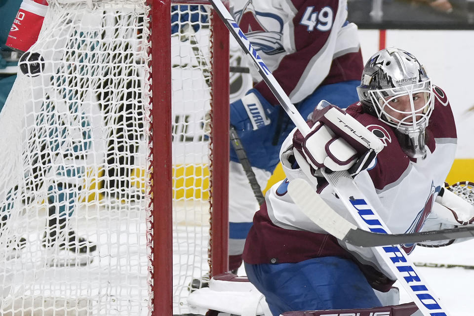 Colorado Avalanche goaltender Alexandar Georgiev (40) looks back into the net after allowing a goal by San Jose Sharks center Jacob Peterson during the third period of an NHL hockey game Tuesday, April 4, 2023, in San Jose, Calif. (AP Photo/Tony Avelar)