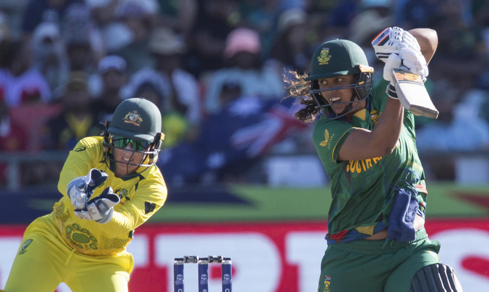 South Africa's Chloe Tryon plays a shot while Australia's Alyssa Healy fields, during the Women's T20 World Cup semi final cricket match between South Africa and Australia, in Cape Town, South Africa, Sunday Feb. 26, 2023. (AP Photo/Halden Krog)