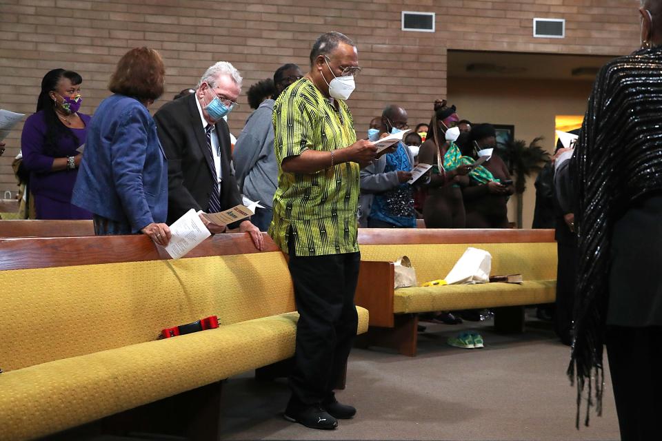 Minister Tommy Enge, center, sings during an event to honor Dr. Martin Luther King, Jr at First Community Baptist Church in Desert Hot Springs, Calif., on Monday, Jan. 17. 2022. 
