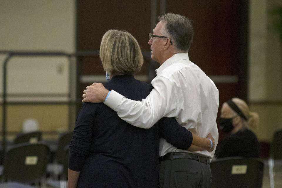 Gay and Bob Hardwick who were attacked in their Stockton home in 1978 by Golden State Killer, Joseph James DeAngelo, stand as the charges are read against DeAngelo during a hearing in Sacramento Superior Court in Sacramento, Calif. Monday June 29, 2020. DeAngelo, 74, pleaded guilty to 13 counts of murder and multiple other charges 40 years after a sadistic series of assaults and slayings in California. (AP Photo/Rich Pedroncelli)