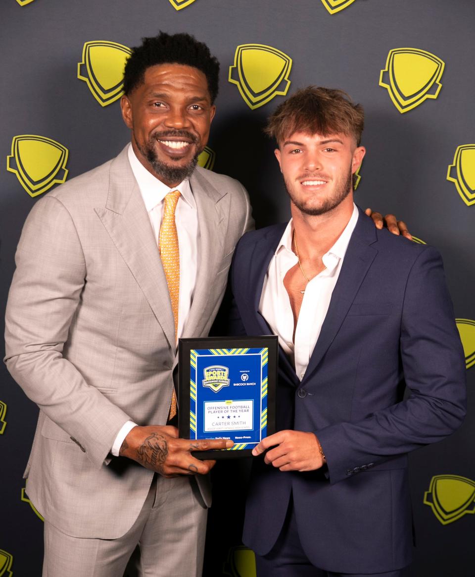 Carter Smith from Bishop Verot is the offensive football player of the year at the Southwest Florida High School Sports Awards at Suncoast Credit Union Arena on the campus of Florida SouthWestern State College in Fort Myers on Thursday, June 6, 2024. He is seen with basketball star Udonis Haslem.