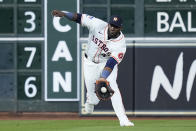Houston Astros left fielder Yordan Alvarez catches a line drive hit by New York Yankees' Anthony Volpe during the sixth inning of a baseball game, Saturday, March 30, 2024, in Houston. (AP Photo/Kevin M. Cox)
